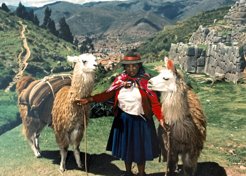 Peruvian lady with llamas near Cusco